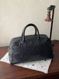Chanel Noir Quilted Voyage