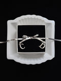 Dior Silver Monogram Bow